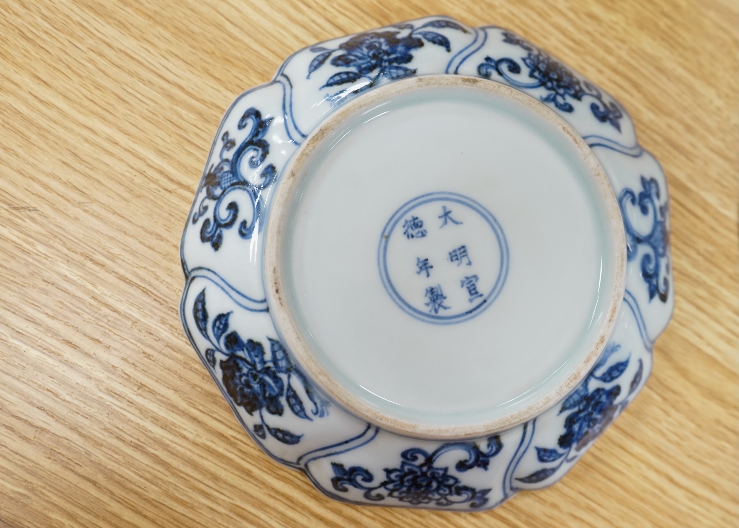 A Chinese copper red glazed dish, a blue and white bowl and a similar dish, bowl 22.5cm diameter. Condition - good